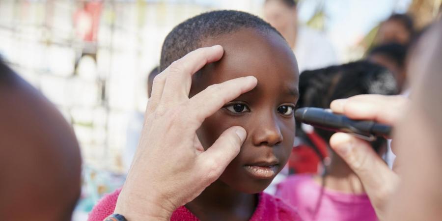 Young child receiving a mobile vision test