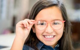Smiling girl with new glasses